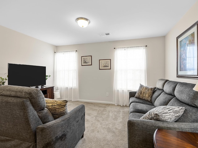 living room featuring light carpet