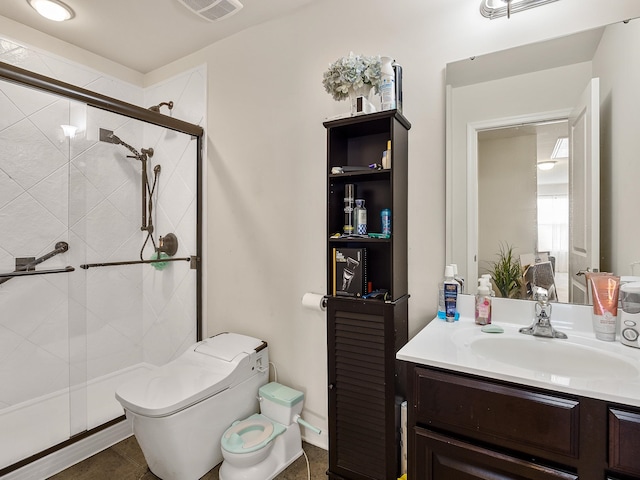 bathroom featuring tile flooring, vanity, toilet, and a shower with door