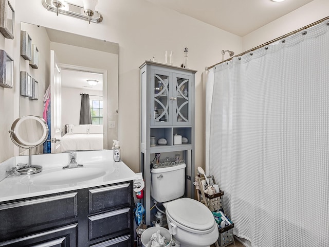 bathroom with oversized vanity and toilet