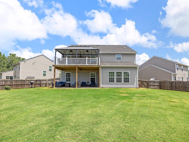 rear view of house with a patio and a lawn