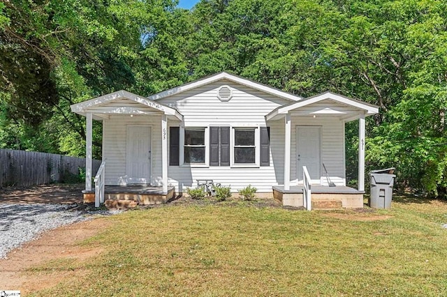 bungalow-style home with a front lawn