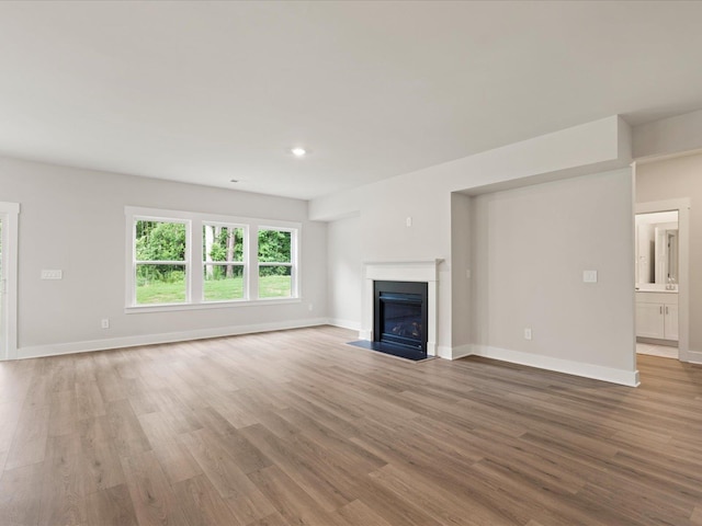 unfurnished living room featuring hardwood / wood-style floors