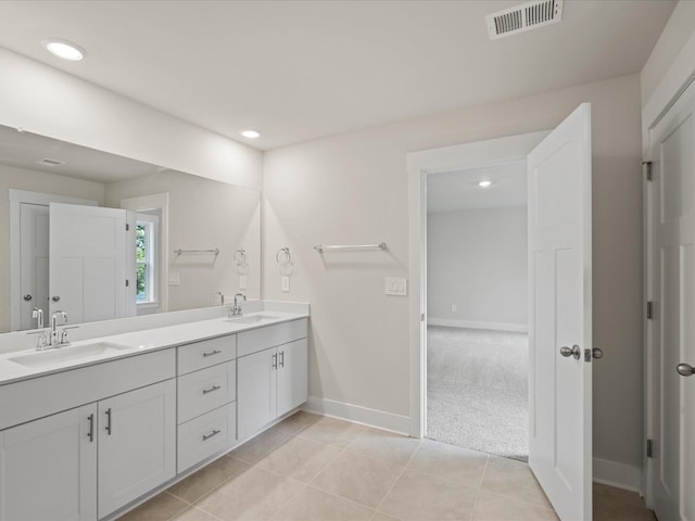 bathroom with tile patterned floors and vanity