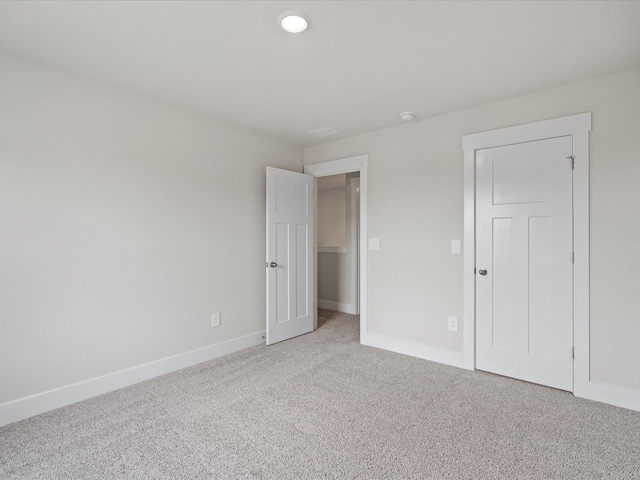 unfurnished bedroom with carpet