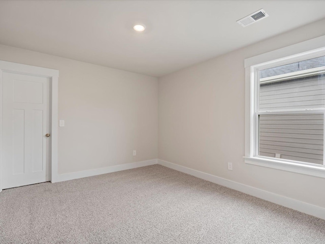 spare room featuring carpet floors