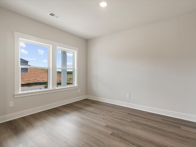 spare room featuring hardwood / wood-style floors