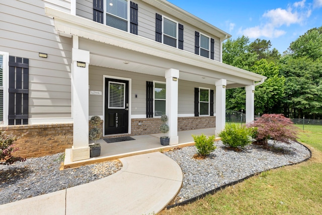 entrance to property featuring covered porch