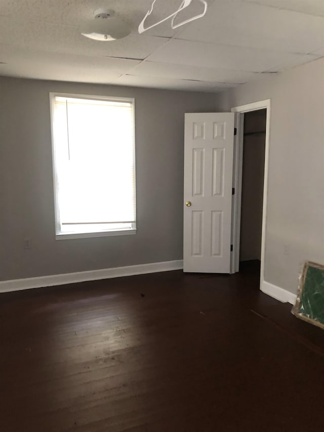 unfurnished room featuring dark hardwood / wood-style flooring