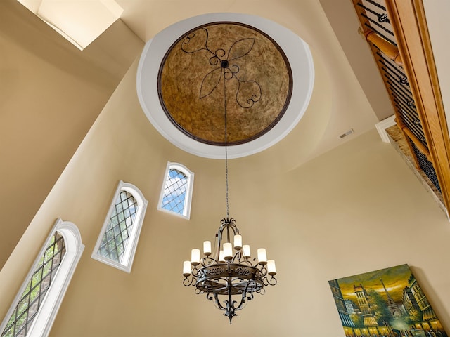 interior details featuring a notable chandelier