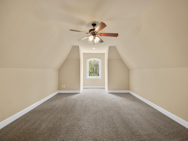 bonus room with carpet, ceiling fan, and vaulted ceiling