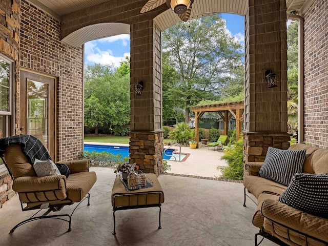 view of patio / terrace with a pergola, ceiling fan, and an outdoor hangout area