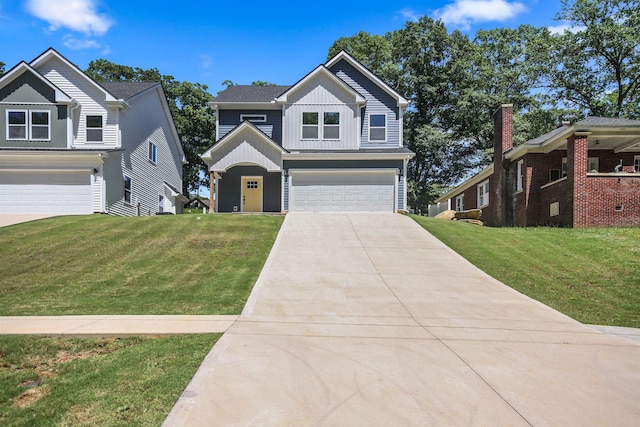 view of front of property with a garage and a front lawn