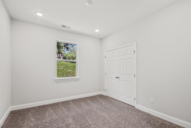 spare room featuring carpet