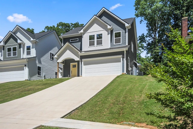 craftsman-style home featuring a garage and a front yard