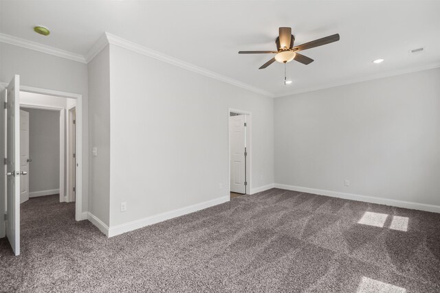 carpeted empty room featuring ceiling fan and ornamental molding