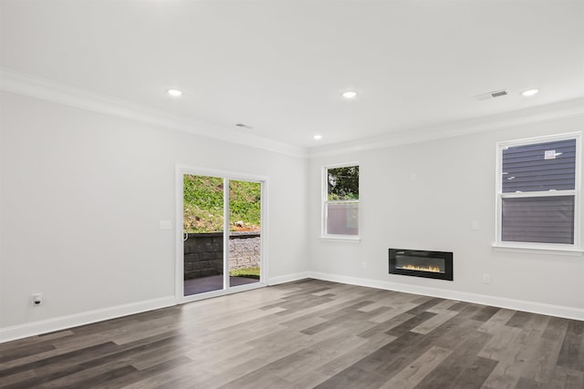 interior space featuring ornamental molding and dark hardwood / wood-style flooring