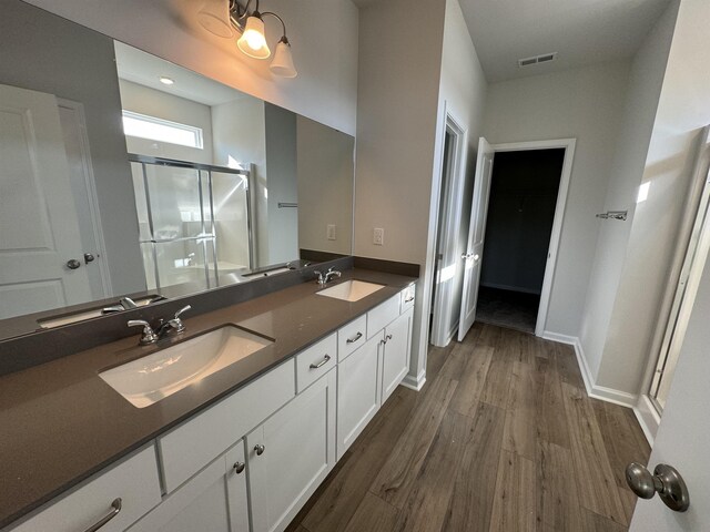 1465 Macedonia, Gaffney, SC 29341 - full bath with a shower stall, wood finished floors, double vanity, baseboards, and a walk in closet