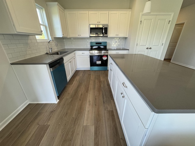 1465 Macedonia, Gaffney, SC 29341 - kitchen featuring appliances with stainless steel finishes, a sink, dark wood-style floors, and dark countertops