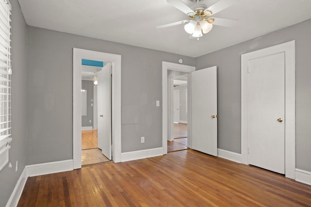 unfurnished bedroom with hardwood / wood-style floors and ceiling fan