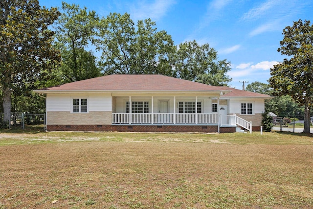 single story home featuring a front yard and covered porch