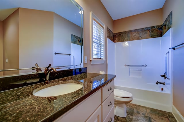full bathroom featuring vanity,  shower combination, and toilet