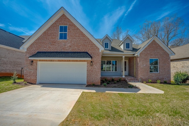 view of front of house with a front yard and a garage