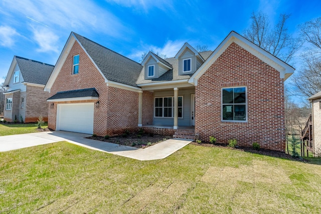 view of front of property featuring a garage and a front yard