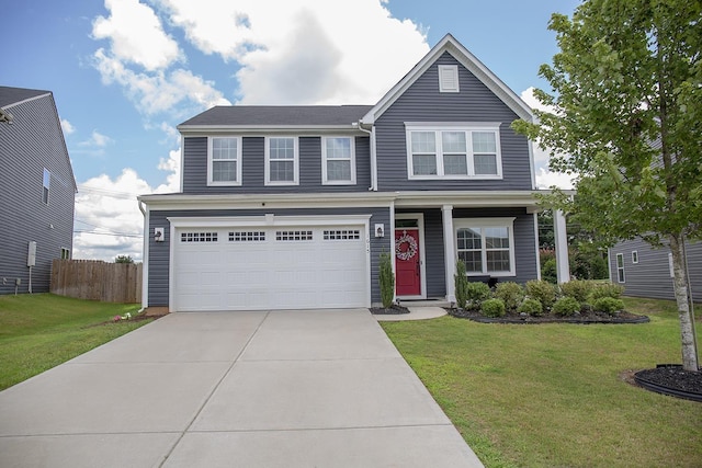 view of front of property featuring a front lawn and a garage