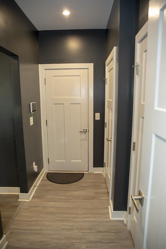 doorway to outside with hardwood / wood-style flooring