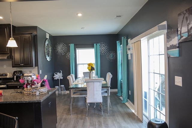 dining room with hardwood / wood-style flooring