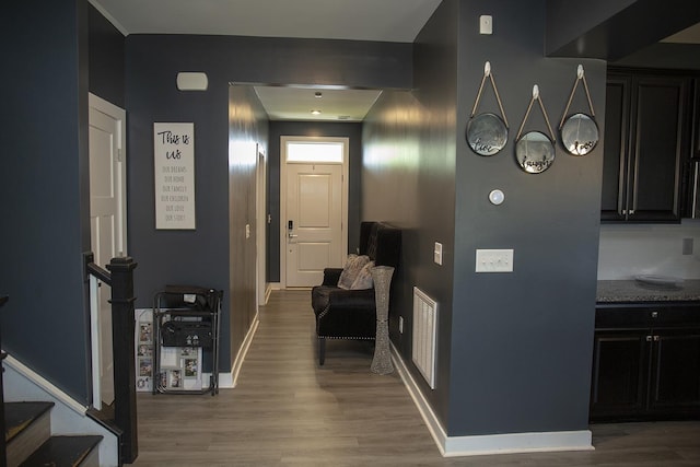 hallway with wood-type flooring