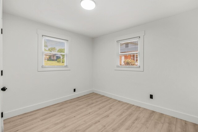 empty room with light hardwood / wood-style floors