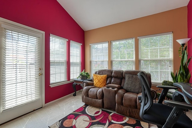 carpeted living room with lofted ceiling