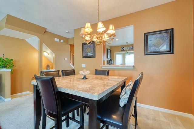 carpeted dining room with a notable chandelier