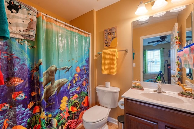 bathroom featuring vanity, ceiling fan, and toilet