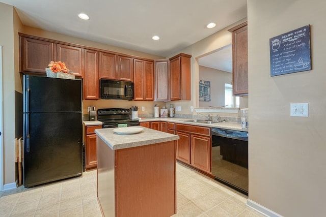 kitchen featuring light tile patterned flooring, black appliances, sink, and a kitchen island