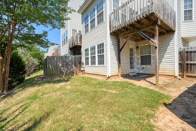 back of house featuring a lawn