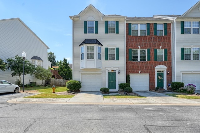 townhome / multi-family property featuring a garage