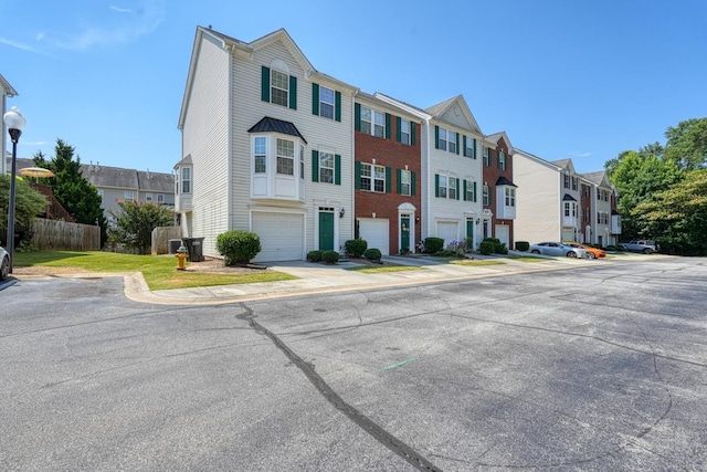 multi unit property featuring a garage