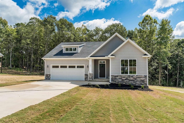 craftsman house with stone siding, concrete driveway, a garage, and a front lawn