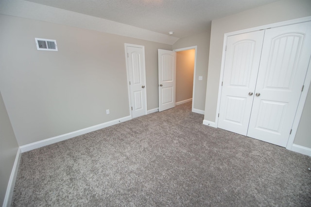 unfurnished bedroom with carpet and baseboards