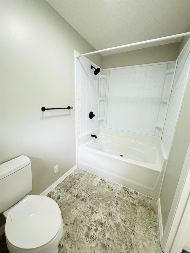 bathroom featuring shower / bath combination and toilet