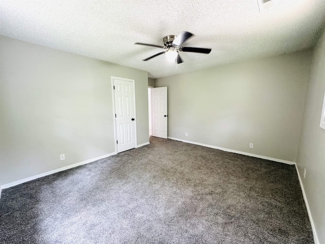 carpeted empty room featuring a textured ceiling and ceiling fan