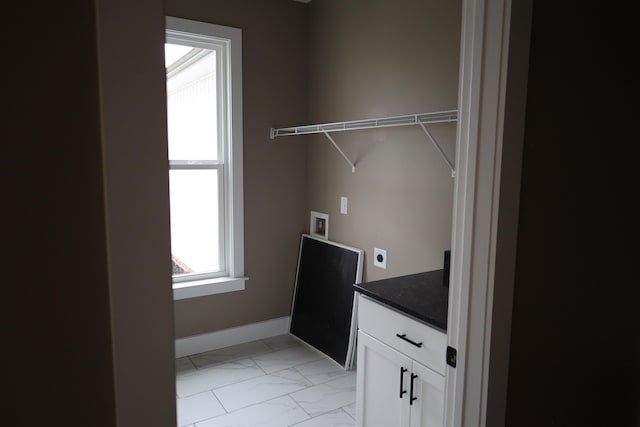 laundry area with cabinets, washer hookup, and electric dryer hookup