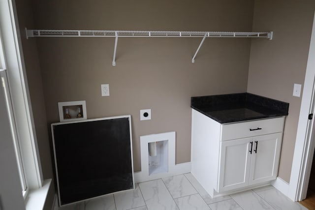 clothes washing area with hookup for an electric dryer and hookup for a washing machine