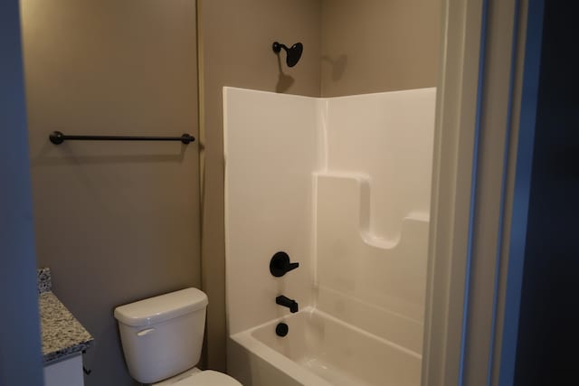 full bathroom featuring vanity,  shower combination, and toilet