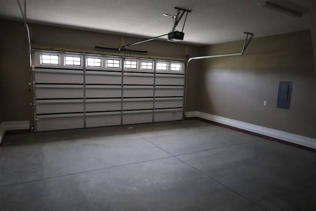 garage featuring a garage door opener and electric panel