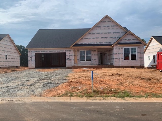 unfinished property with a garage