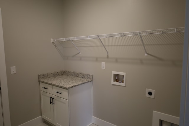 clothes washing area featuring hookup for a washing machine and hookup for an electric dryer