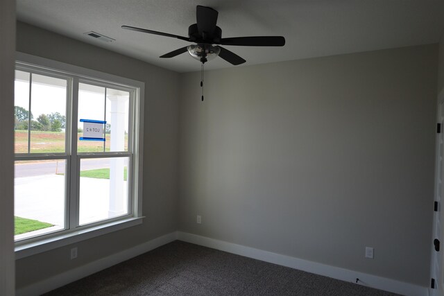 unfurnished living room featuring hardwood / wood-style flooring, a textured ceiling, and a wealth of natural light